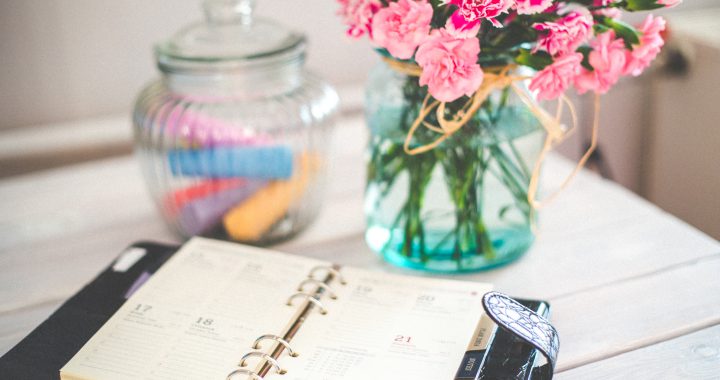 https://www.pexels.com/photo/personal-organizer-and-pink-flowers-on-desk-6374